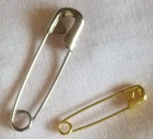 medium and small sized fastened safety pins,